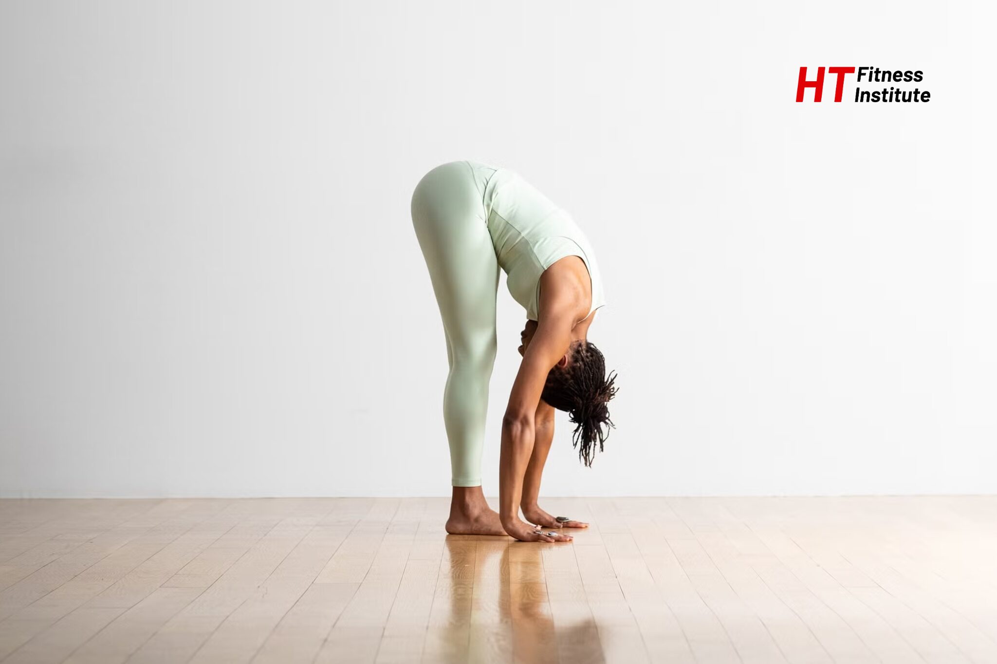 Bài tập giãn cơ Standing forward fold (gập người chạm mũi chân)